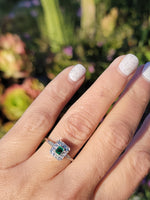 platinum emerald & diamond halo estate ring