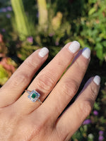platinum emerald & diamond halo estate ring