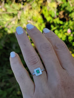 platinum emerald & diamond halo estate ring