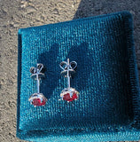 14k white gold ruby and diamond halo studs