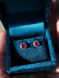 14k white gold ruby and diamond halo studs