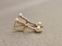 Platinum & 18k gold two tone diamond & pearl antique dangle "bow" earrings