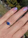 Platinum blue sapphire & baguette diamond estate ring