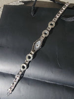 14k white gold c.1920's Art Deco filigree diamond & camphor bracelet
