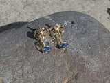 14k gold blue sapphire bezel stud earrings - .20ct tw