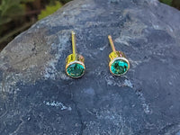 14k gold emerald bezel stud earrings - .19ct tw